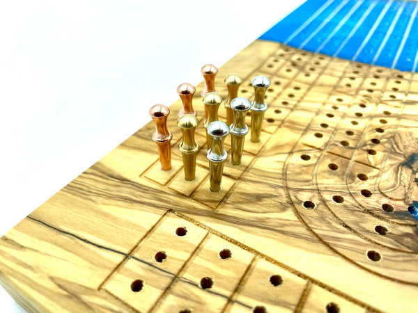 Incredible cribbage board of OLIVE WOOD + maui blue epoxy resin | metal pegs with storage included | engraving available